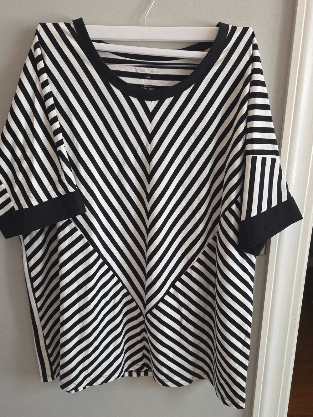 Woman Within Black and White Striped Short Sleeve Top. (A42)